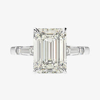 An exceptional 5 Carat, three stone emerald cut, ring is perfect for proposals, engagement rings, or as a promise ring.