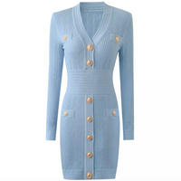 The Natalynska Sasha dress is an elegant long-sleeved mini dress with deep plunging neckline, and gold button detail. This sexy, sophisticated dress balmain inspired baby blue